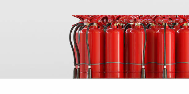 istock A lot of fire extinguishers on a grey background. Clipping path included 1202891732