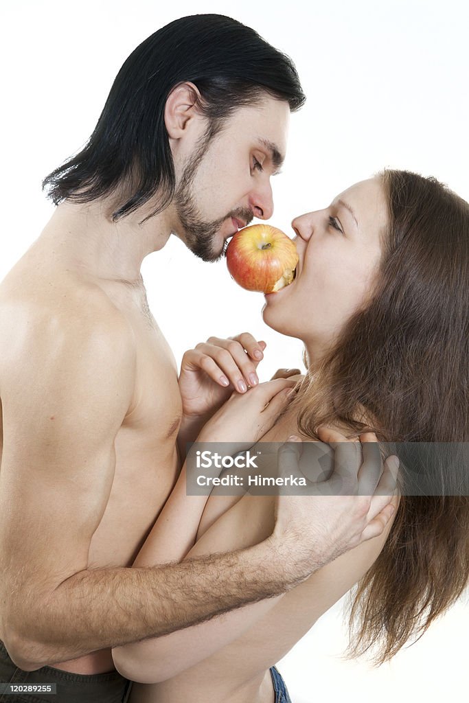 Isoliert auf weiss Männliche und weibliche Essen apple - Lizenzfrei Adam - Bibelfigur Stock-Foto