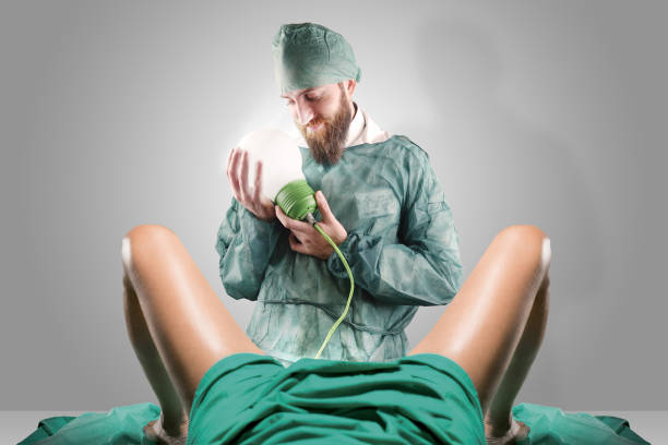 Doctor and woman legs giving birth to a light bulb Doctor and woman legs giving birth to a light bulb overworked funny stock pictures, royalty-free photos & images