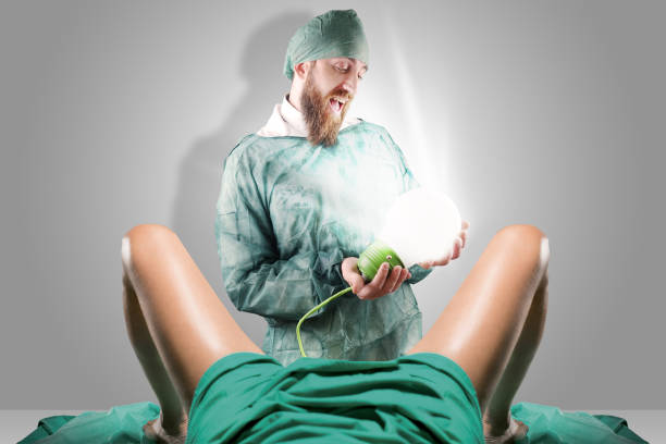 Doctor and woman legs giving birth to a light bulb
