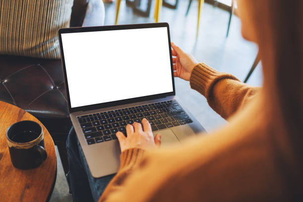 istock a woman using and typing on laptop computer with blank white desktop screen 1202896774