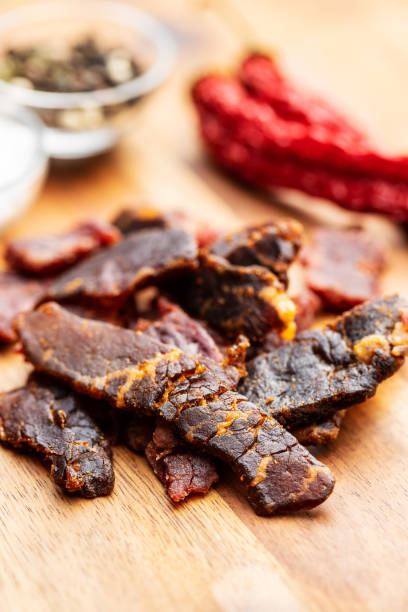 istock Beef jerky pieces. Dried beef meat. 1202898067