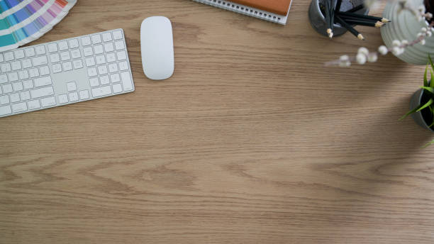 istock Top view of modern rustic workspace with computer device, office supplies and decorations 1202900022