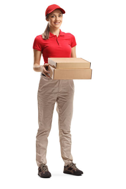 istock Young delivery woman holding boxes 1202900449