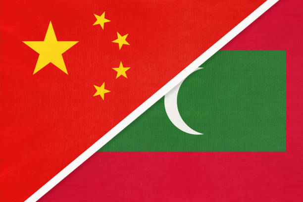 istock People's Republic of China or PRC vs Maldives national flag from textile. Relationship between two asian countries. 1202901426
