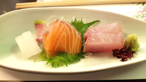 istock Assortment of sashimis served on a plate 1202901962