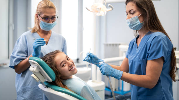 istock Little girl having a dental exam 1202903219