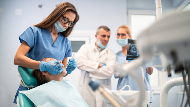 istock Little girl having a dental exam 1202903227