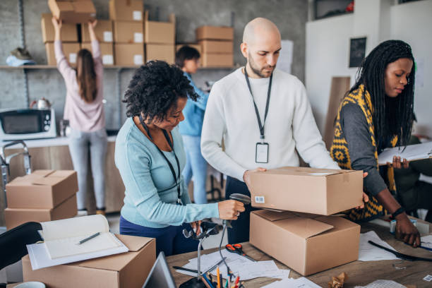 istock Diverse group of people arranging customers orders for drop shipping 1202903410