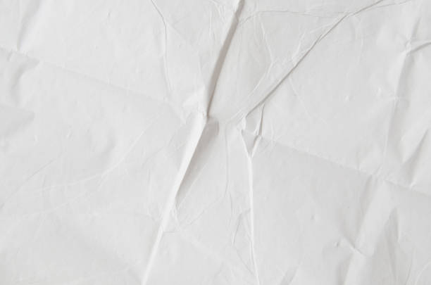 istock Creative background with scattered overlay of crumpled papers. 1202903548