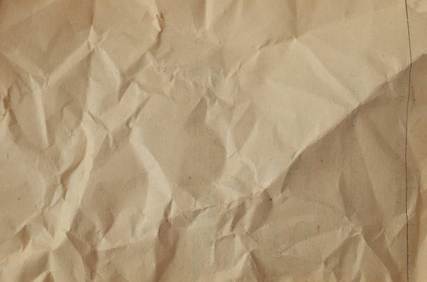 istock Creative background with scattered overlay of crumpled papers. 1202903567