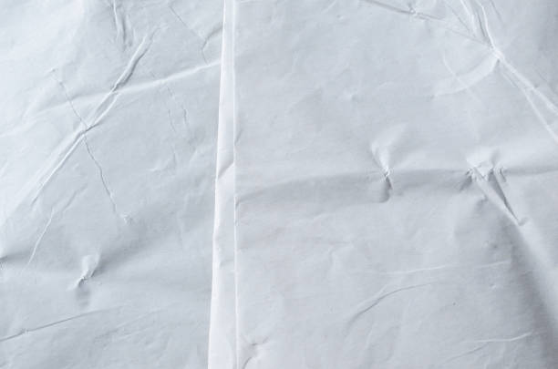 istock Creative background with scattered overlay of crumpled papers. 1202904281
