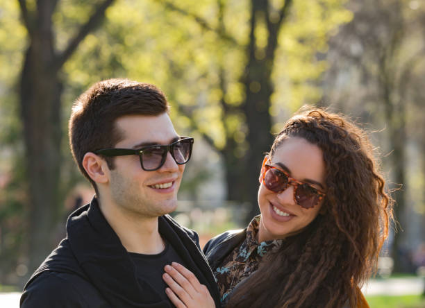 istock Modern urban couple posing in the park. 1202905344