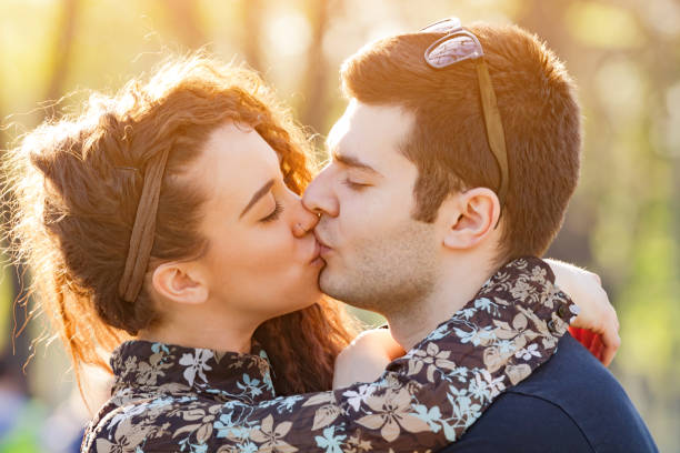 istock Modern urban couple posing in the park. 1202905405