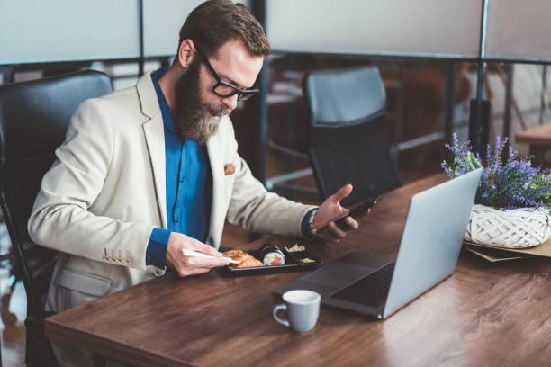 istock Businessman in the office eating lunch 1202905660