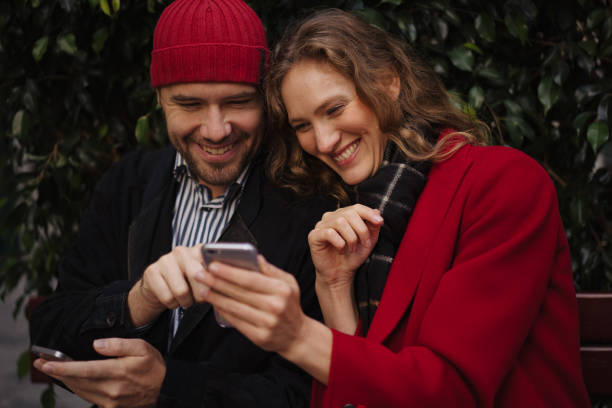 istock Couple in love using cellphone 1202906653