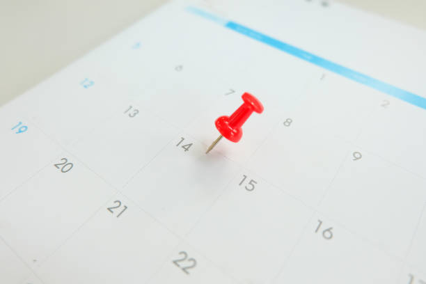 istock Close up red pin on calendar marking on Valentine's Day.Love concept. 1202906861
