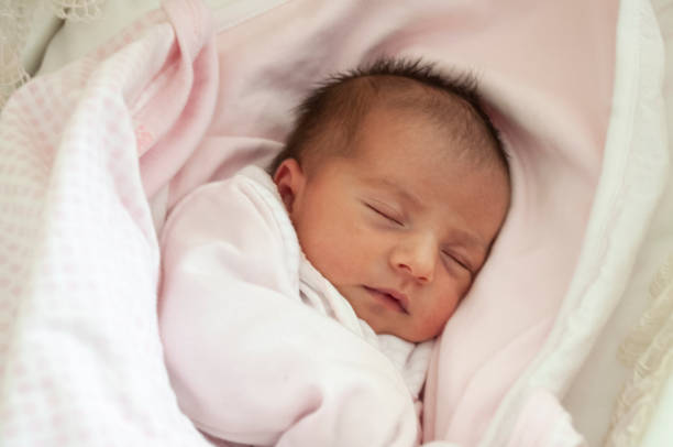 istock Newborn baby sleeping five days after birth 1202906872