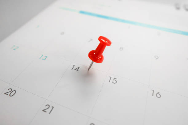 istock Close up red pin on calendar marking on Valentine's Day.Love concept. 1202906885