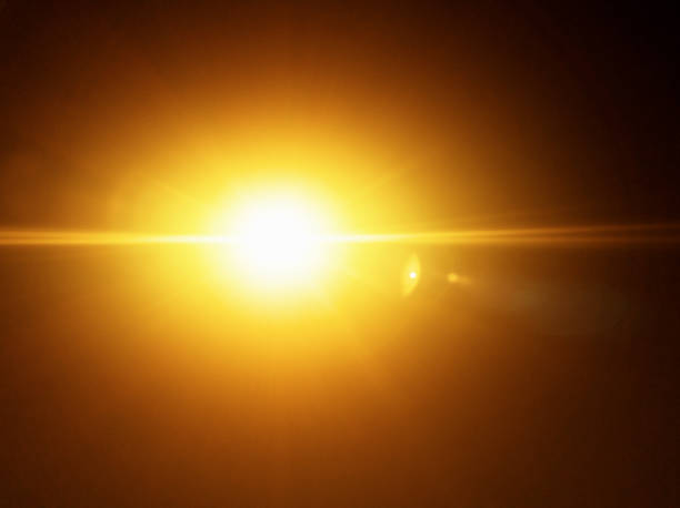 istock Dazzling golden sky against darkened sky 1202907048
