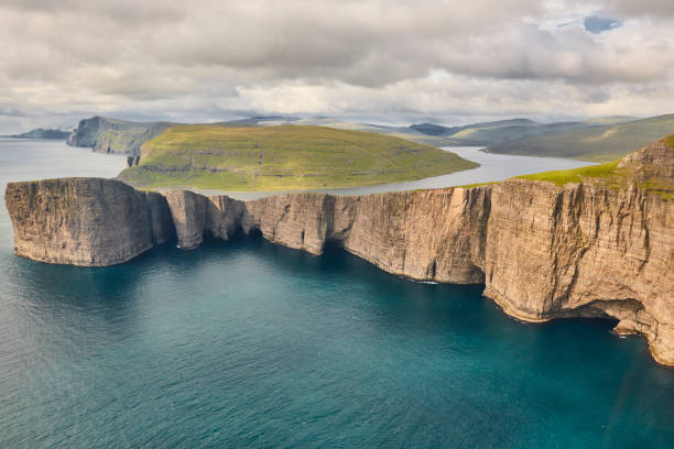 istock Faroe islands dramatic coastline in Vagar. Leitisvatn lake 1202907174