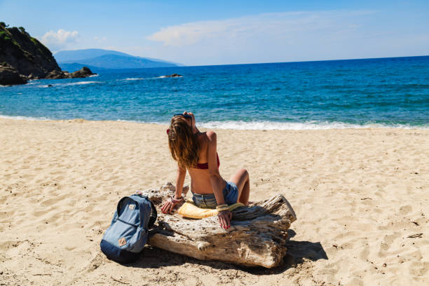 Woman enjoying on a sandy tropical beach.