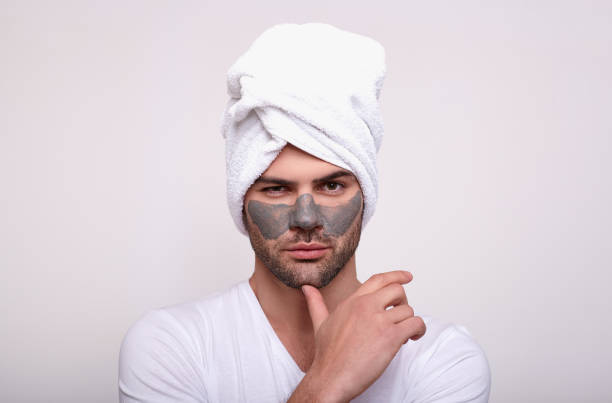 Frustrated angry unhappy sad man isn't atisfied with a mask. stock photo