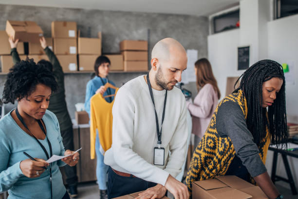 istock Diverse group of people arranging customers orders for drop shipping 1202909476