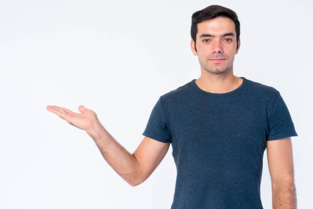 istock Portrait of young handsome Persian man showing something 1202909582