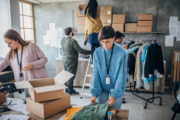 istock Diverse group of people arranging customers orders for drop shipping 1202909609