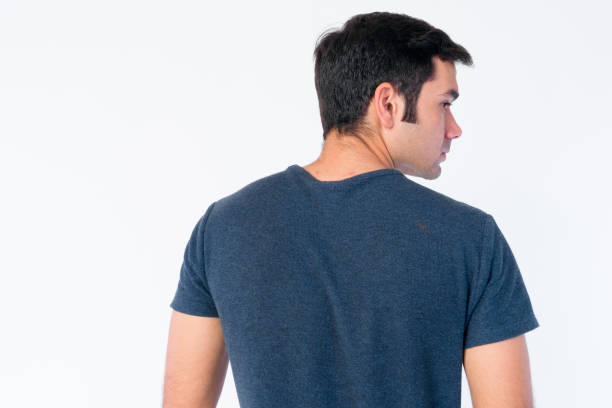 istock Rear view of young Persian man looking over shoulder 1202909638