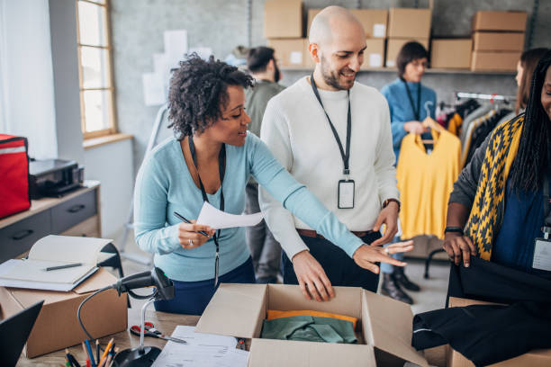 istock Diverse group of people arranging customers orders for drop shipping 1202909715