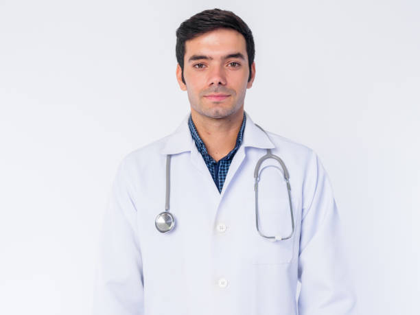 istock Face of young Persian man doctor looking at camera 1202909839