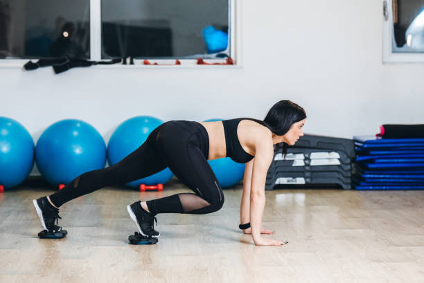 istock Young woman in a gym 1202910580