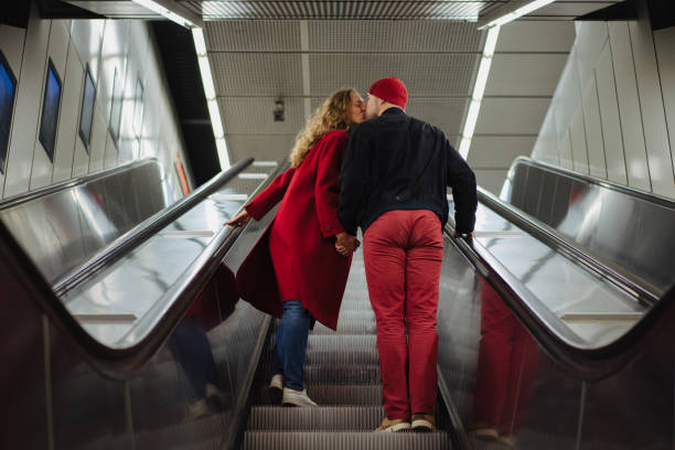 istock Romantic couple on the escalator 1202911512
