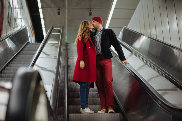 istock Romantic couple on the escalator 1202911646