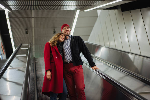istock Smiling couple on the escalator 1202911728