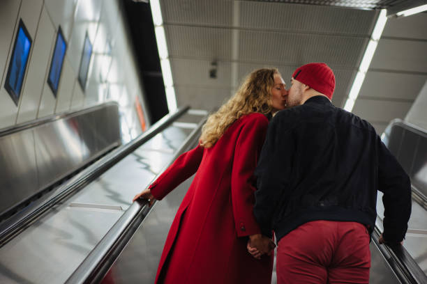 istock Romantic couple on the escalator 1202911919