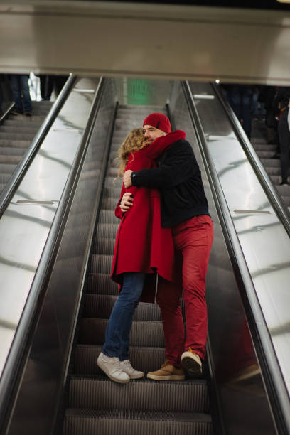 istock Romantic couple on the escalator 1202911931