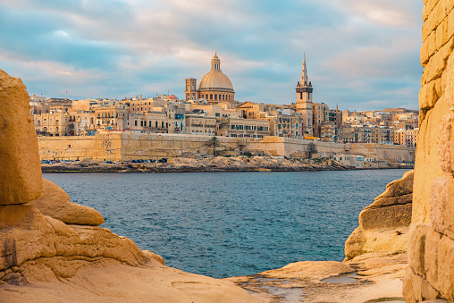 View of Valletta, Malta old town skyline from Sliema city on the other side of Marsans harbor during sunrise