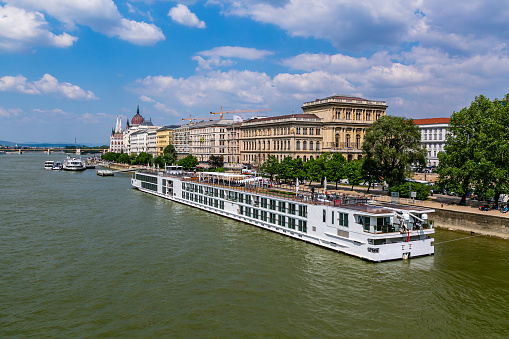 Bratislava, Slovakia - August 23, 2022: City skyline and ferry along Danube River.