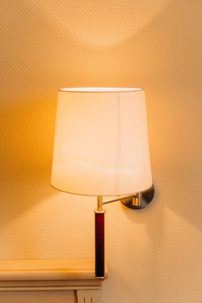 istock lamp sconce inside bedroom interior dresser wall 1202915904