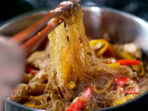 istock Cooking cellophane noodles and chicken 1202916298