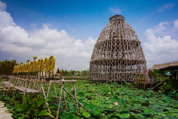 Bamboo Tower and lotus lake at Sapan Khong floating market. Suphanburi, Thailand-October 5, 2019: Bamboo Tower and lotus lake at Sapan Khong floating market. bamboo bridge stock pictures, royalty-free photos & images