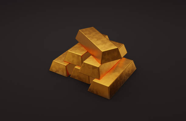 istock Golden bricks on black background. Stacked bars of gold metal. 3d rendering 1202920366