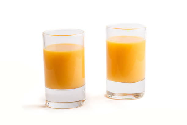 istock Sweet egg liqueur in glass isolated on white background. Side view, close up. 1202920701