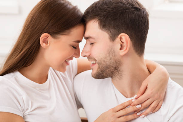 istock Loving Couple Hugging Sitting In Bed At Home, Selective Focus 1202925150