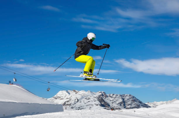 istock Skier jumps in snow park 1202925446