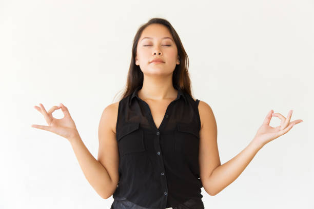 istock Relaxed woman meditating with closed eyes 1202931167