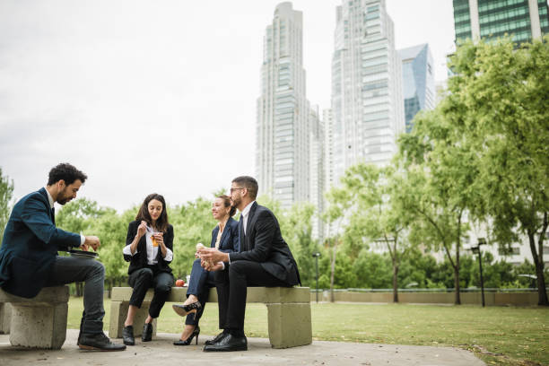istock Colleagues on a lunch break in the park 1202933043